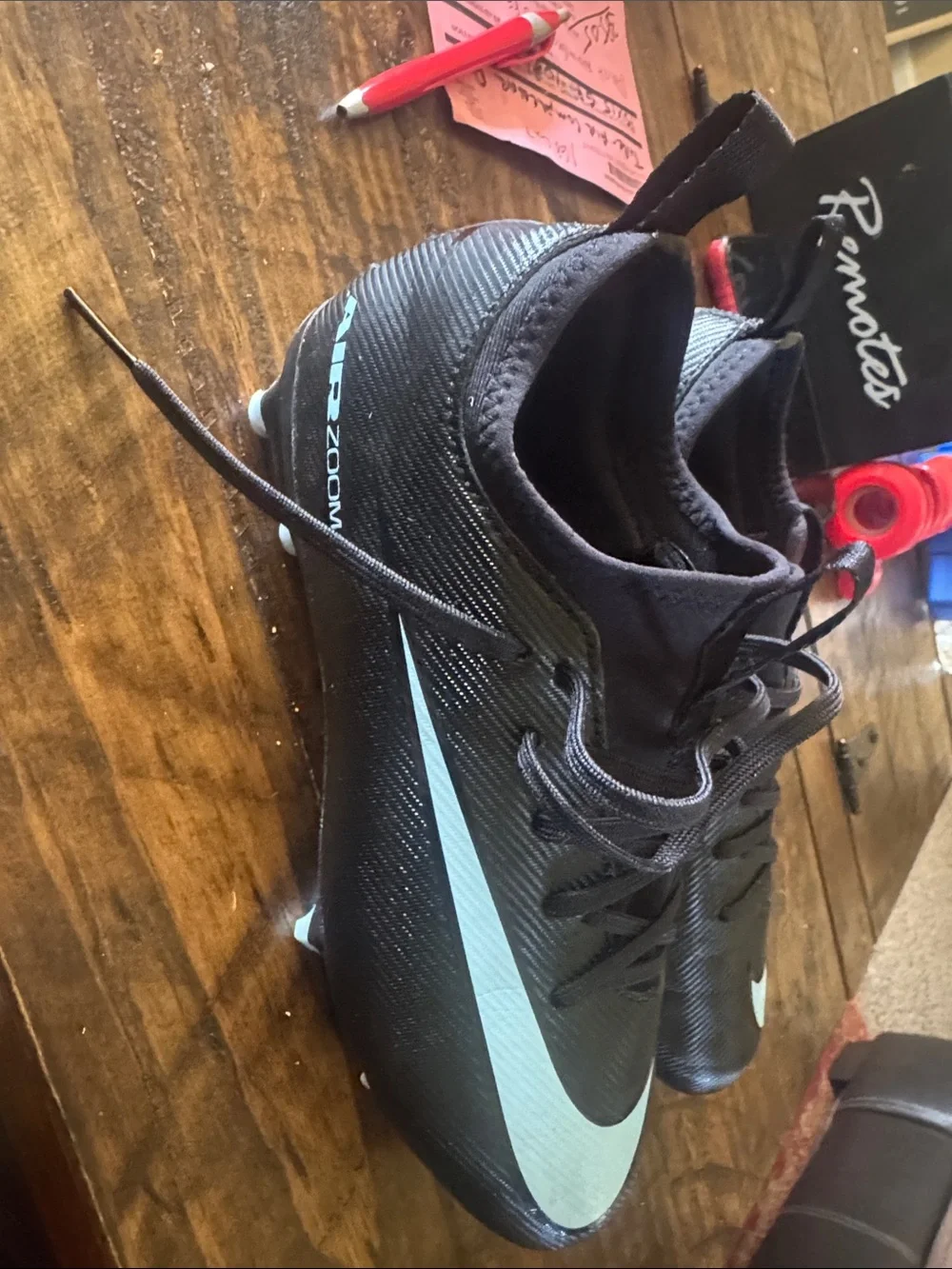 Nike Black Cleats with Light Blue Swoosh